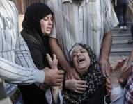 Una mujer llora por los familiares muertos en el conflicto entre Israel y Hamás.