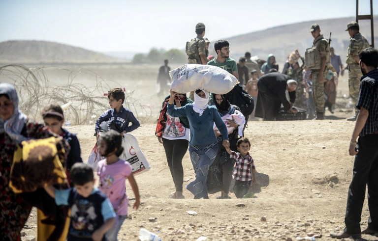 Ascienden a más de 60.000 los kurdos que huyen de Siria a Turquía en un día