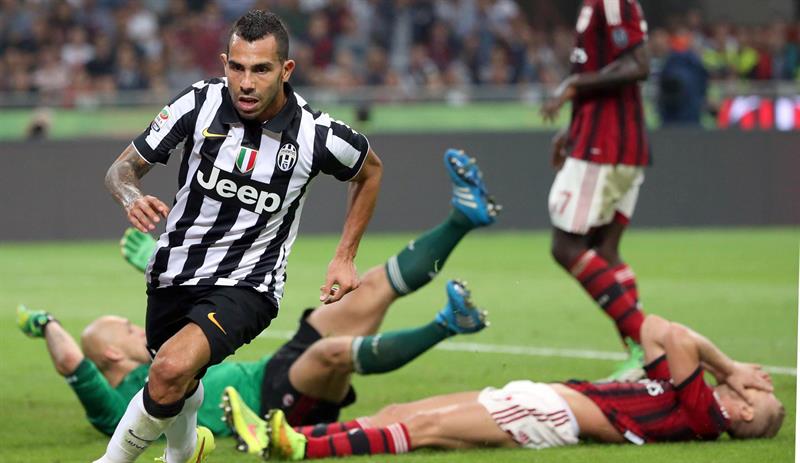 Juventus doblega al Milan con gol de Tevez y alcanza el liderato