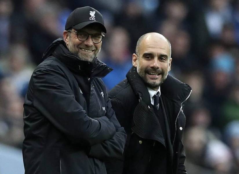 Jürgen Klopp, técnico del Liverpool, y Pep Guardiola, del Manchester City, en una imagen de archivo.