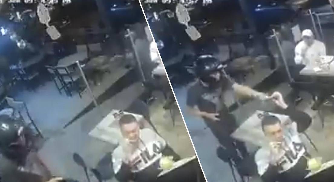 Un hombre no deja de comer sus alitas de pollo durante un robo a mano armada en un restaurante en México