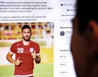 Una persona revisa información sobre la amenaza de muerte al jugador de Irán, Amir Nasr-Azadani.