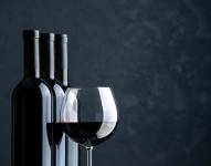 front view bottles of wine with glass of wine on dark background alcohol beer grape color bar dinner photo restaurant free space