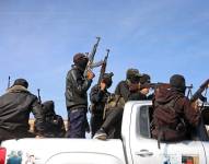 Miembros del ala armada de Hamás, las Brigadas Ezzedine al-Qassam, participan en un desfile militar en una calle de Deir el-Balah, en el centro de la Franja de Gaza, el 19 de enero de 2025.