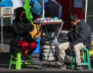 Vista de vendedores de tabaco en Quito.