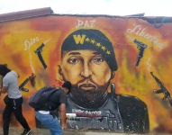 Foto de un mural de Los Tiguerones con el rostro de Willian Alcívar, alias Comandante Willy, en Socio Vivienda 2 de Guayaquil.