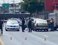 Imagen de un procedimiento policial por el asesinato de un trabajador portuario en el sur de Guayaquil.