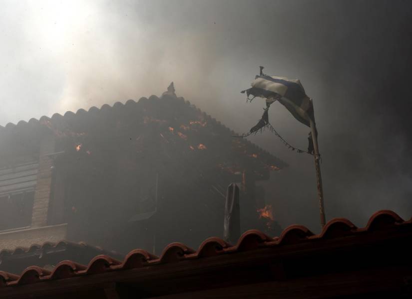 Una casa afectada por los incendios en la localidad de Lagonisi, a 40 kilómetros de Atenas, Grecia.
