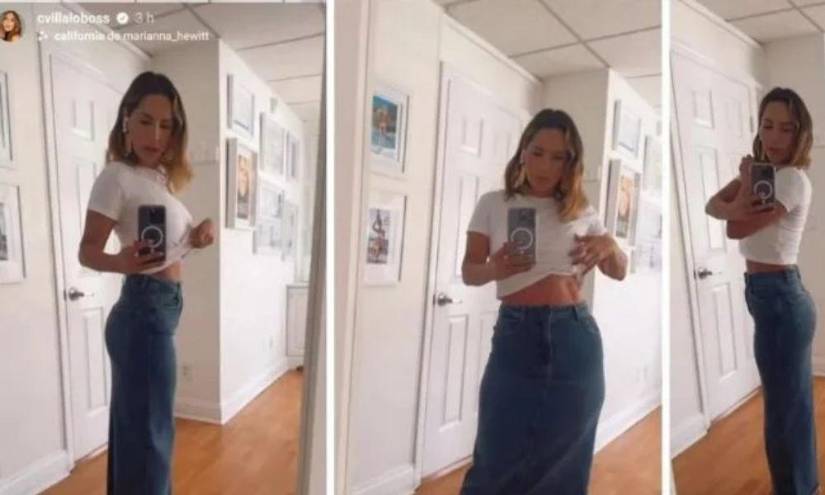 Carmen Villalobos mostrando sus abdominales de acero frente a un espejo, acción con los que desmiente rumores sobre un supuesto embarazo en una imagen de archivo.